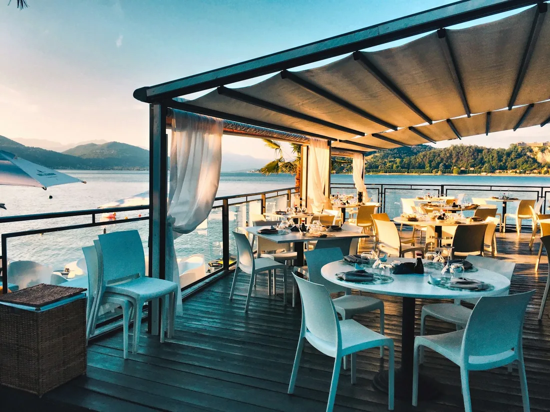 An open restaurant terrace with a beautiful view and elegantly set tables
